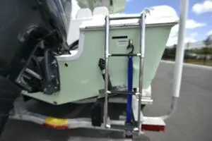 Slide: The Image of Trailer wheels of 2023 Sea Pro 239 Deep V CC boat on pavement. - 13