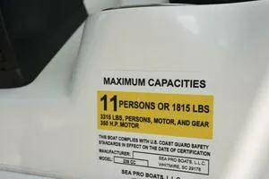 Slide: The Image of 2023 Sea Pro 239 Deep V CC boat interior with white seating under a blue sky. - 20