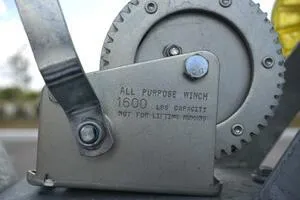 Slide: The Image of 2023 Sea Pro 239 Deep V CC boat interior under a partly cloudy sky. - 21