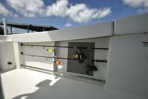 Slide: The Image of 2023 Sea Pro 239 Deep V CC boat with white cushioned seating under a blue sky. - 28