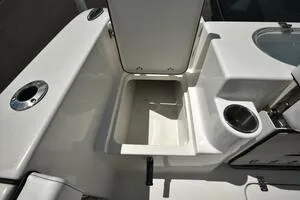 Slide: The Image of 2023 Sea Pro 239 Deep V CC boat interior with storage compartment and cup holder. - 29