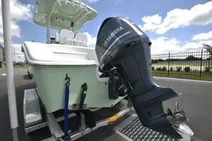 Slide: The Image of 2023 Sea Pro 239 Deep V CC boat logo against a clear blue sky. - 4