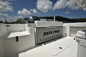 Slide: The Image of 2023 Sea Pro 239 Deep V CC boat on trailer near storage facility. - 8