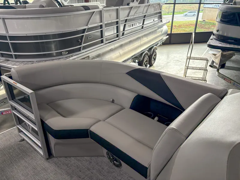 Slide: The Image of 2025 Trifecta 22 UL LE T pontoon boat interior with gray seating and modern design. - 8