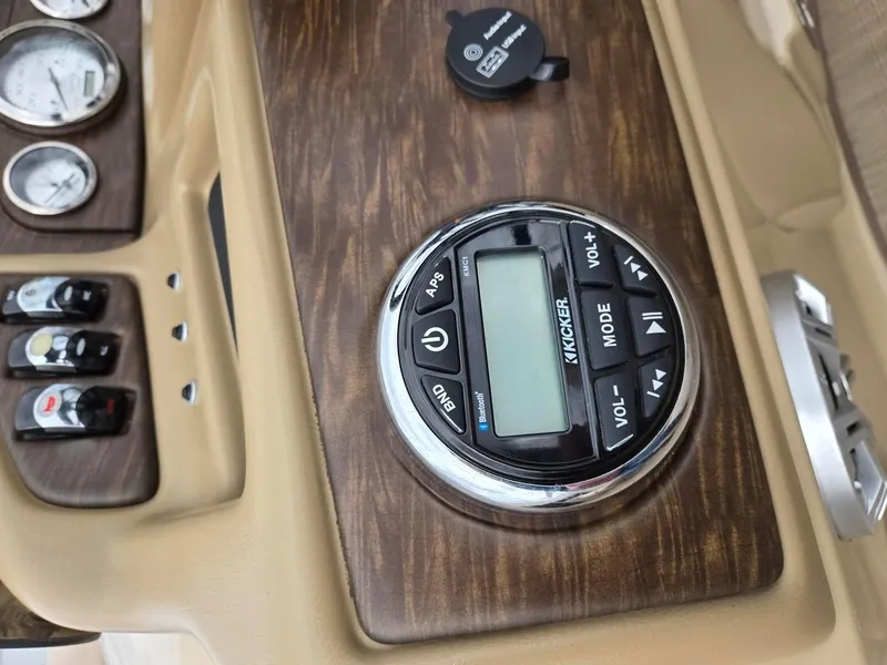 Slide: The Image of Dashboard of 2017 Bennington 22GSR with Kicker audio controls and gauges. - 10