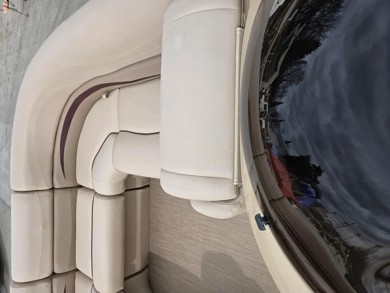 Slide: The Image of 2017 Bennington 22GSR boat interior with beige seating and sleek design. - 12
