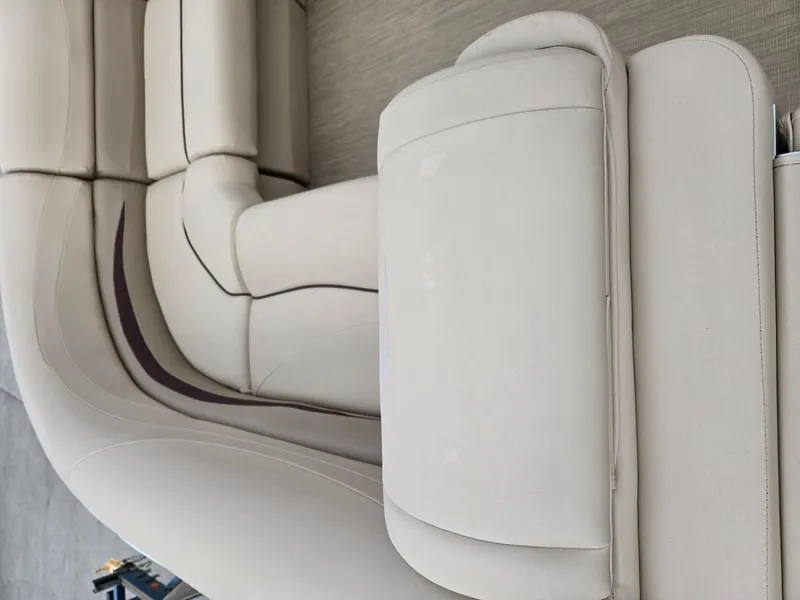 Slide: The Image of 2017 Bennington 22GSR boat interior with beige cushioned seating. - 14