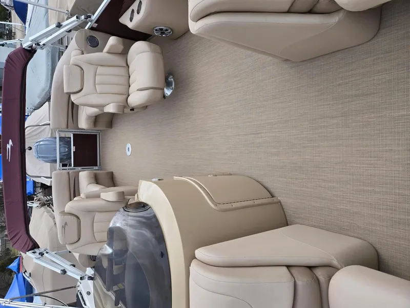 Slide: The Image of 2017 Bennington 22GSR pontoon boat interior with beige seating and carpet. - 17