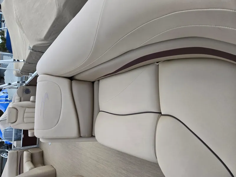 Slide: The Image of 2017 Bennington 22GSR boat interior with beige leather seating and elegant design. - 18