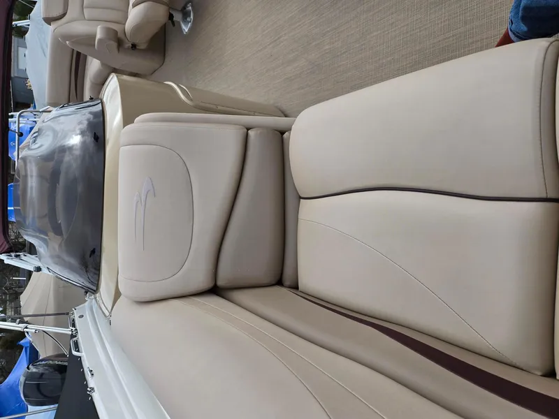 Slide: The Image of 2017 Bennington 22GSR boat interior with beige seating and sleek design. - 19