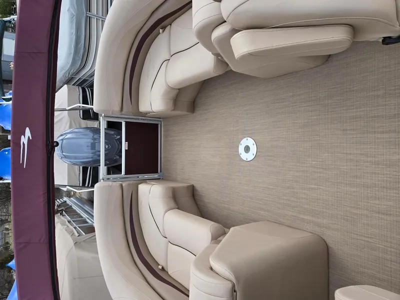 Slide: The Image of 2017 Bennington 22GSR pontoon boat interior with beige seating and carpet. - 22
