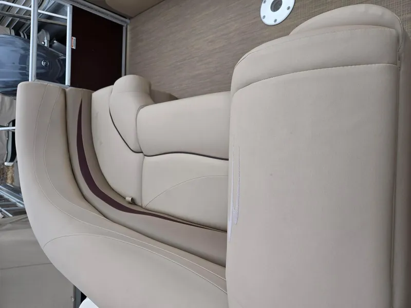 Slide: The Image of 2017 Bennington 22GSR boat interior with beige seating and sleek design. - 24
