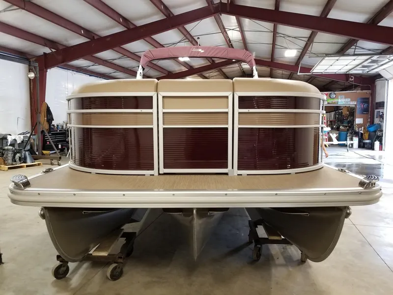 Slide: The Image of 2017 Bennington 22GSR pontoon boat in a garage, front view. - 3