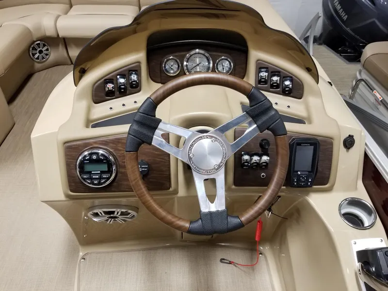 Slide: The Image of 2017 Bennington 22GSR boat dashboard with steering wheel and control panel. - 30