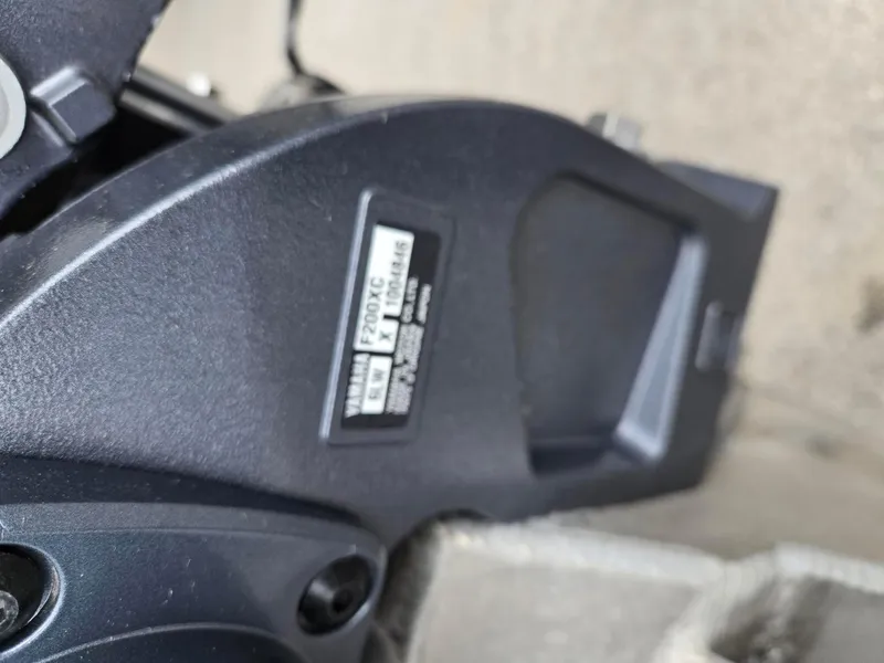 Slide: The Image of Close-up of a Yamaha F200XC engine part on a 2017 Bennington 22GSR boat. - 36