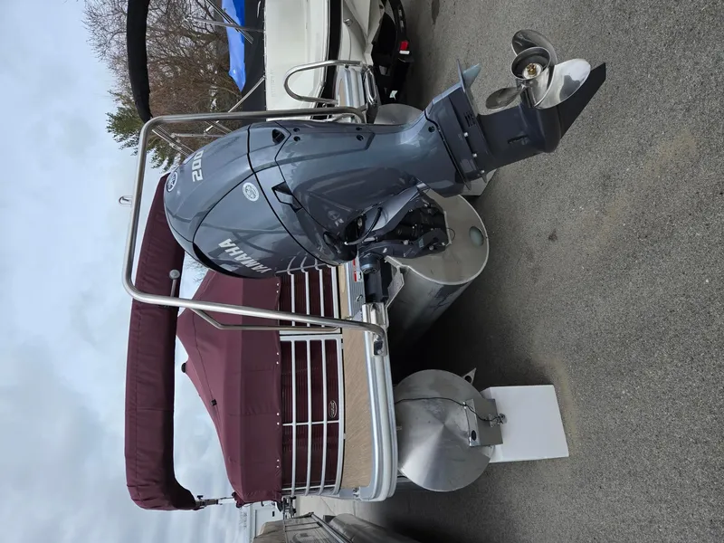 Slide: The Image of 2017 Bennington 22GSR pontoon boat with Yamaha outboard motor, maroon canopy, and aluminum pontoons. - 5