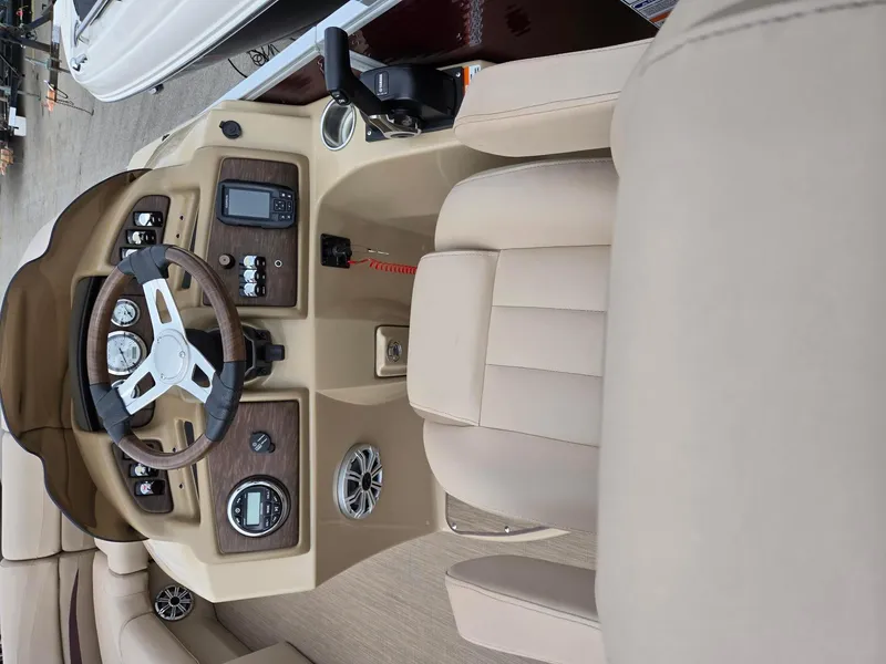 Slide: The Image of 2017 Bennington 22GSR boat interior with steering wheel and control panel. - 9