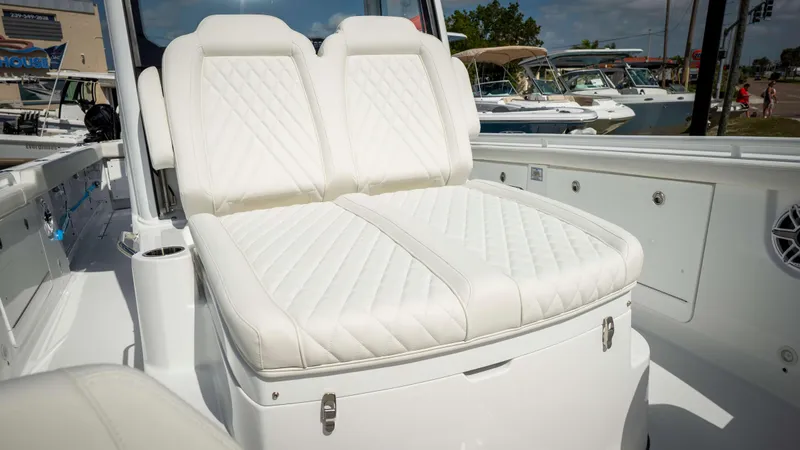 Slide: The Image of 2025 Everglades 315 CC boat with luxurious white seating and sleek design. - 12