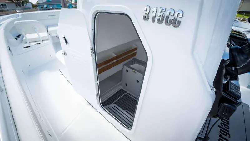 Slide: The Image of 2025 Everglades 315 CC boat interior with open cabin door. - 22