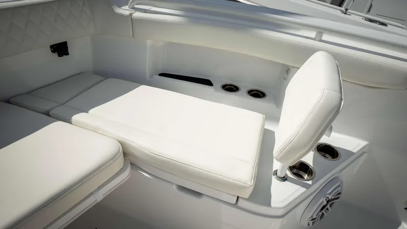 Slide: The Image of Luxurious seating on 2025 Everglades 315 CC boat, featuring white cushioned design. - 5