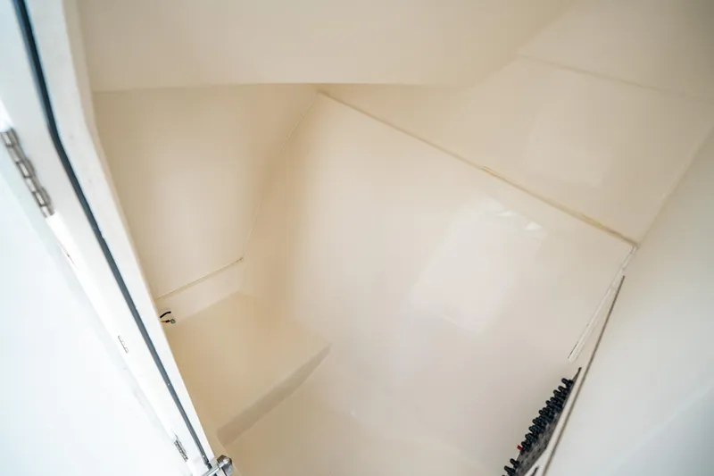 Slide: The Image of Interior cabin of 2020 Cobia 330 DC boat, featuring sleek white design. - 35