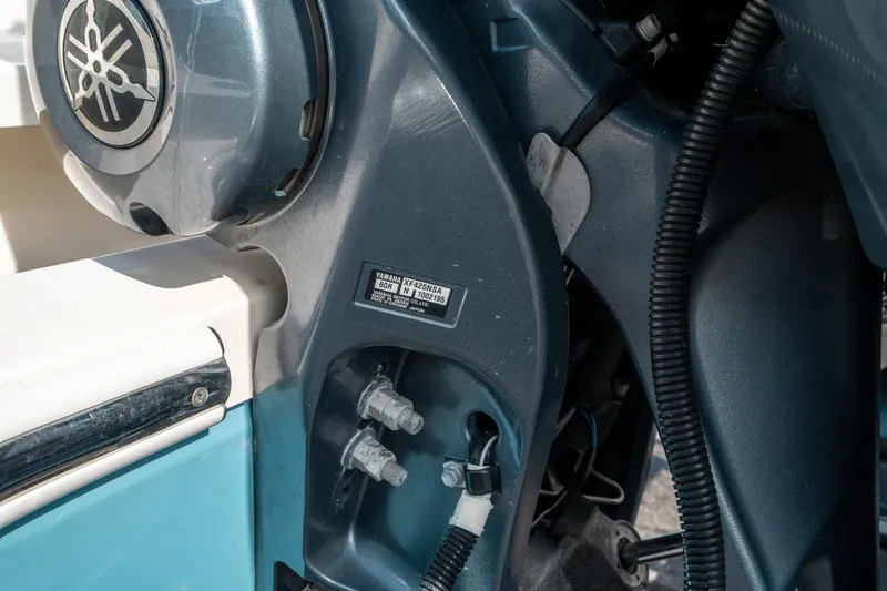 Slide: The Image of Close-up of a Yamaha motor on a 2020 Cobia 330 DC boat. - 46