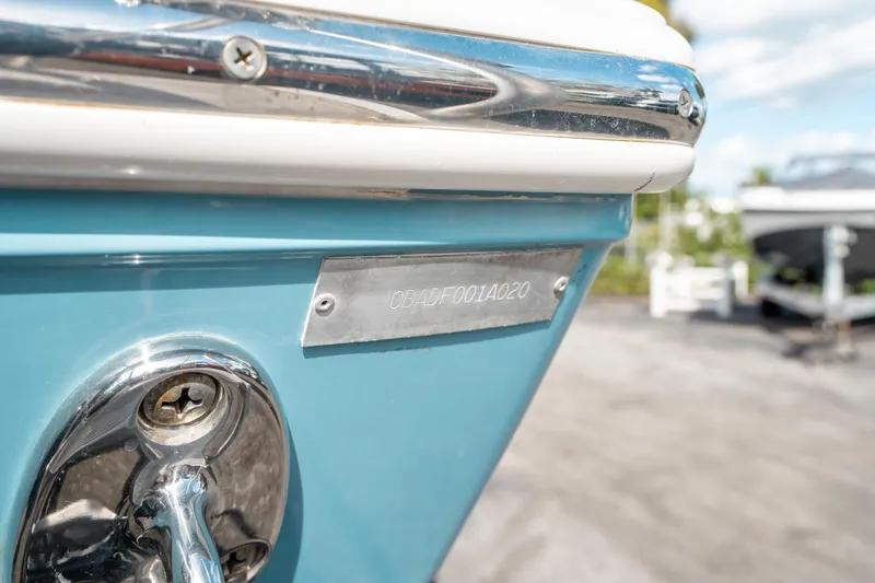 Slide: The Image of Close-up of a 2020 Cobia 330 DC boat's hull identification number plate. - 48