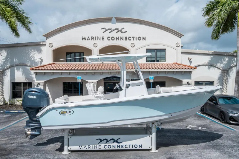 Slide: The Image of 2025 Sea Hunt Ultra 219 boat displayed at Marine Connection dealership. - 1