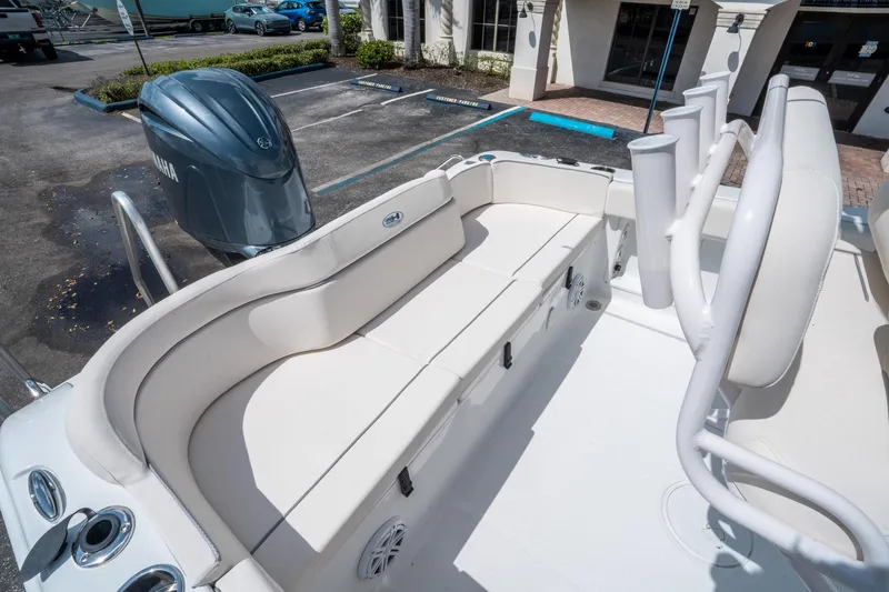 Slide: The Image of 2025 Sea Hunt Ultra 219 boat interior with seating and Yamaha engine. - 10