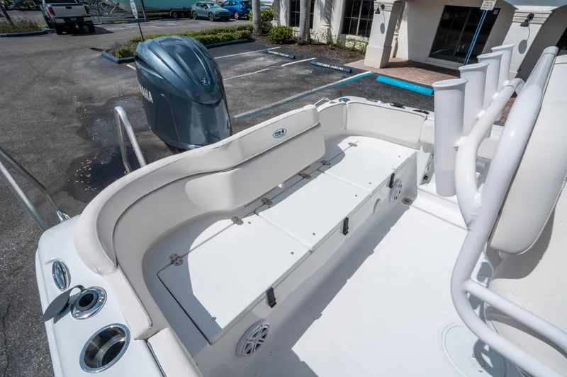 Slide: The Image of 2025 Sea Hunt Ultra 219 boat interior with seating and Yamaha outboard motor. - 12