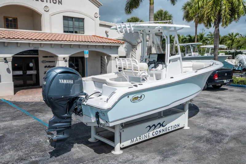 Slide: The Image of 2025 Sea Hunt Ultra 219 boat with Yamaha engine at Marine Connection dealership. - 2