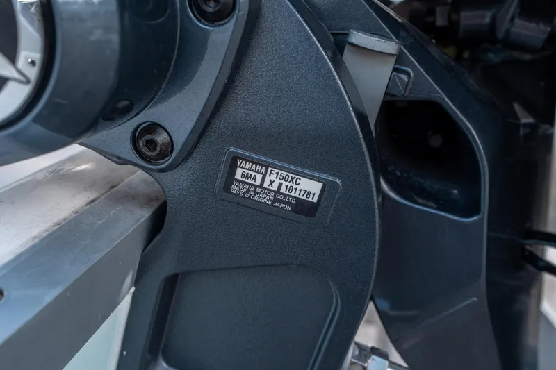Slide: The Image of Close-up of Yamaha F150XC engine on 2025 Sea Hunt Ultra 219 boat. - 27