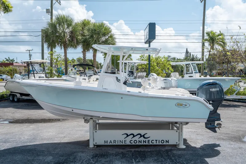 Slide: The Image of 2025 Sea Hunt Ultra 219 boat displayed at Marine Connection dealership. - 5
