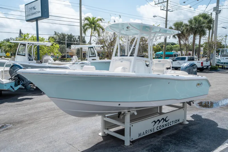Slide: The Image of 2025 Sea Hunt Ultra 219 boat displayed at Marine Connection dealership. - 6