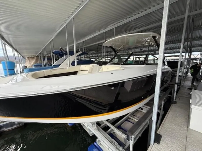 Slide: The Image of 2020 Cobalt R30 boat docked in covered marina. - 1
