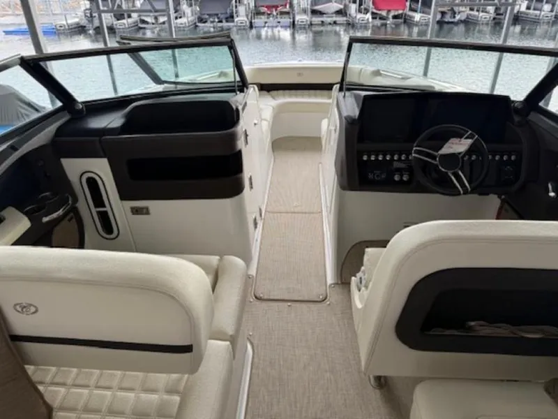 Slide: The Image of Interior of a 2020 Cobalt R30 boat with modern seating and dashboard. - 11