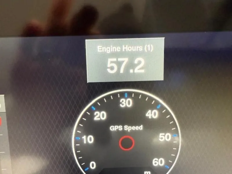Slide: The Image of Dashboard display showing 57.2 engine hours and GPS speedometer on a 2020 Cobalt R30. - 14