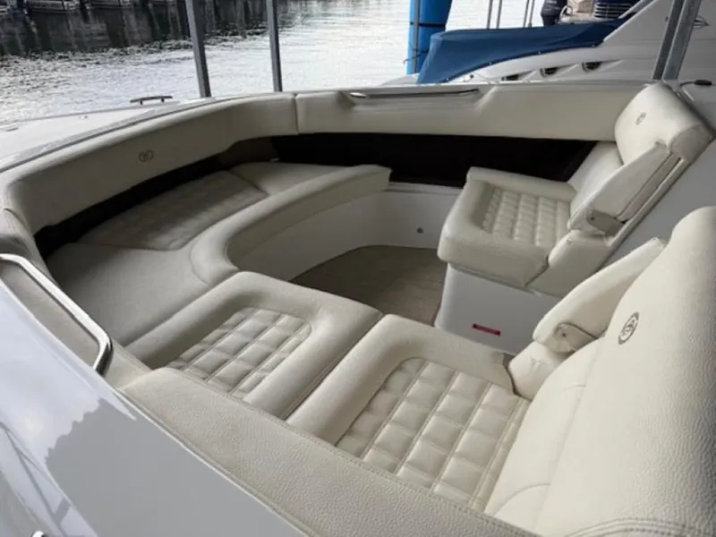 Slide: The Image of Luxurious seating area on a 2020 Cobalt R30 boat, featuring plush, cream-colored upholstery. - 16