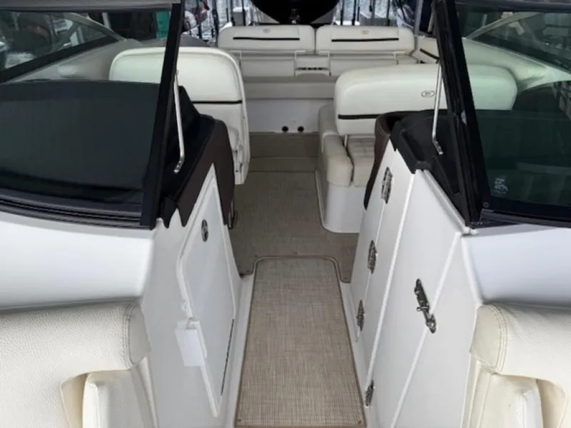 Slide: The Image of 2020 Cobalt R30 boat interior with white seating and carpeted flooring. - 17