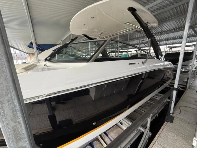 Slide: The Image of 2020 Cobalt R30 boat in a covered dock, showcasing sleek design and modern features. - 2