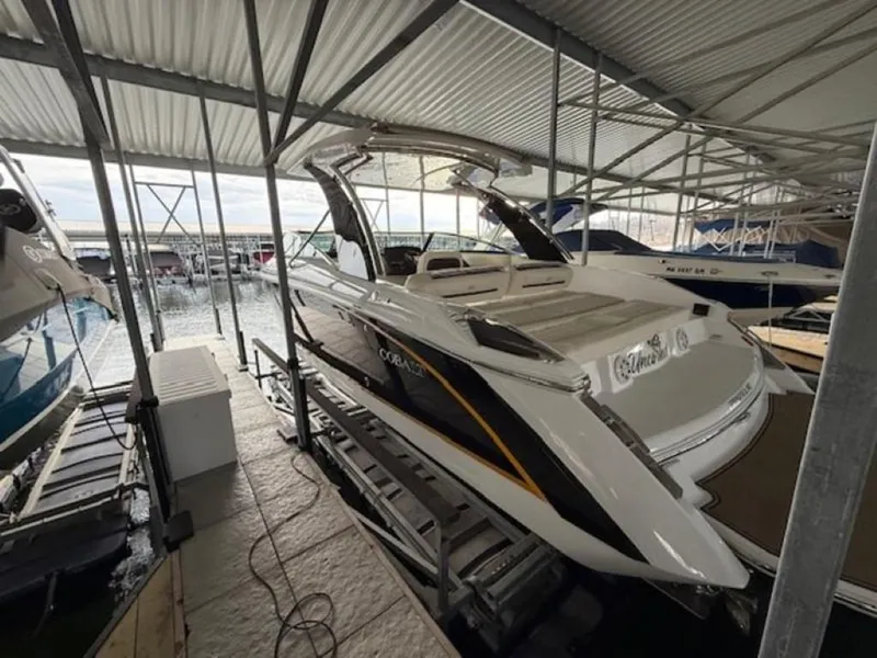 Slide: The Image of 2020 Cobalt R30 boat docked in a covered marina. - 3