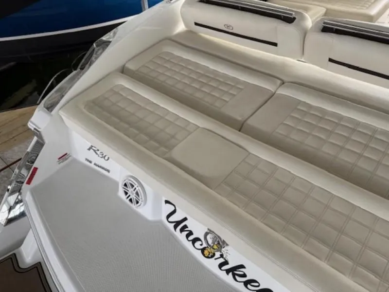 Slide: The Image of 2020 Cobalt R30 boat with white cushioned seating and "Uncorked" decal. - 6