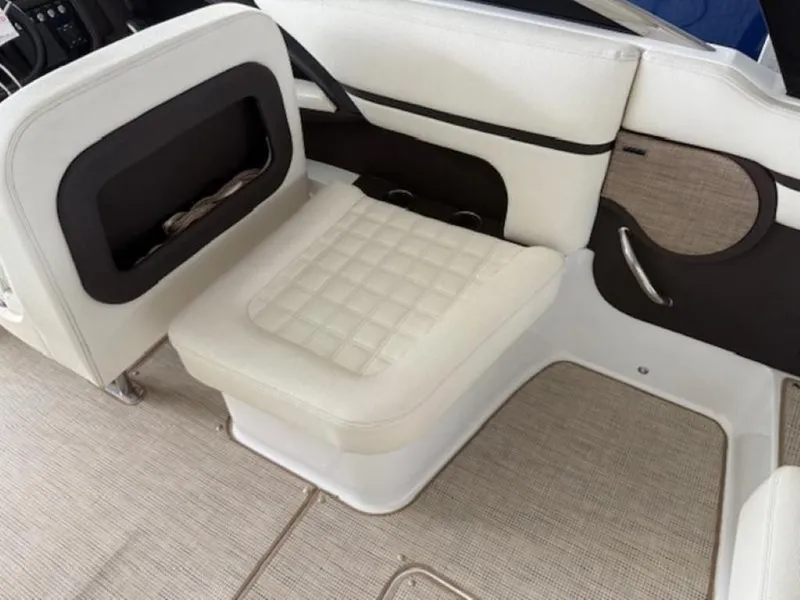 Slide: The Image of 2020 Cobalt R30 boat interior with white cushioned seating and beige flooring. - 9