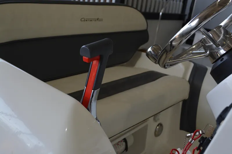 Slide: The Image of 2016 Walker Bay Generation 340 DLX boat interior with steering wheel and throttle control. - 10