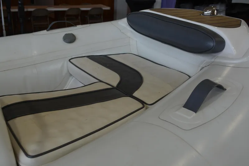 Slide: The Image of 2016 Walker Bay Generation 340 DLX boat interior with cushioned seating and sleek design. - 9