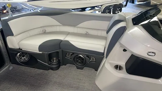 Slide: The Image of Luxurious seating area in 2025 Tahoe LTZ 2385 RL boat with integrated speakers. - 10