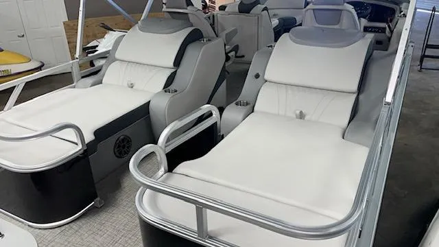 Slide: The Image of 2025 Tahoe LTZ 2385 RL boat interior with luxurious white seating and modern design. - 4