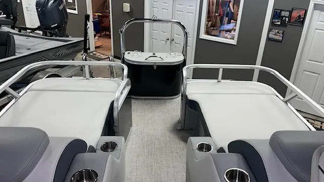 Slide: The Image of 2025 Tahoe LTZ 2385 RL boat interior with seating and cup holders. - 5