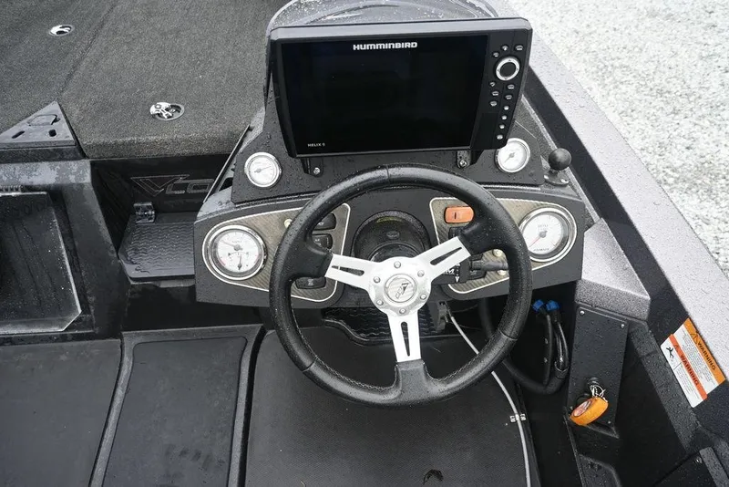 Slide: The Image of Steering console of 2012 Stratos 189VLO boat with Humminbird display and gauges. - 11