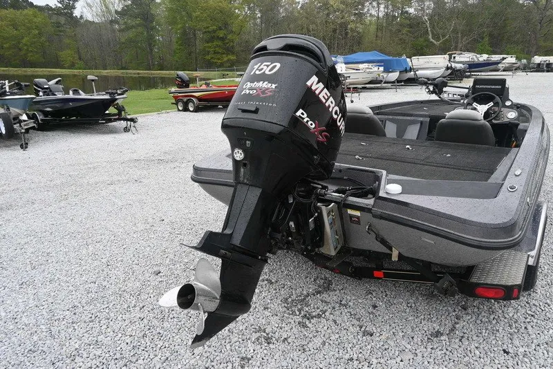 Slide: The Image of 2012 Stratos 189VLO boat with Mercury Pro XS outboard motor in a parking area. - 3